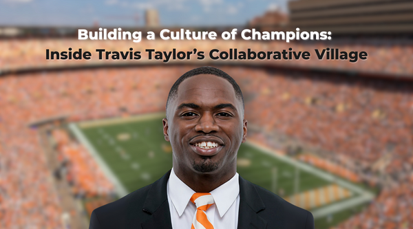 Travis Taylor smiling in front of a blurred football stadium, wearing a suit with an orange-and-white striped tie.