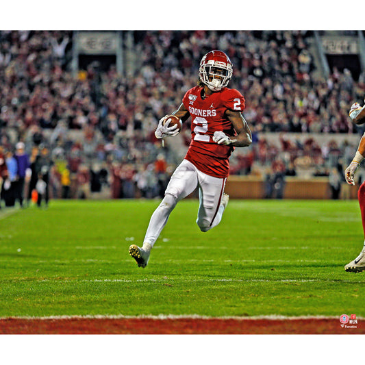 CeeDee Lamb Oklahoma Sooners Unsigned Red Jersey Running Photograph