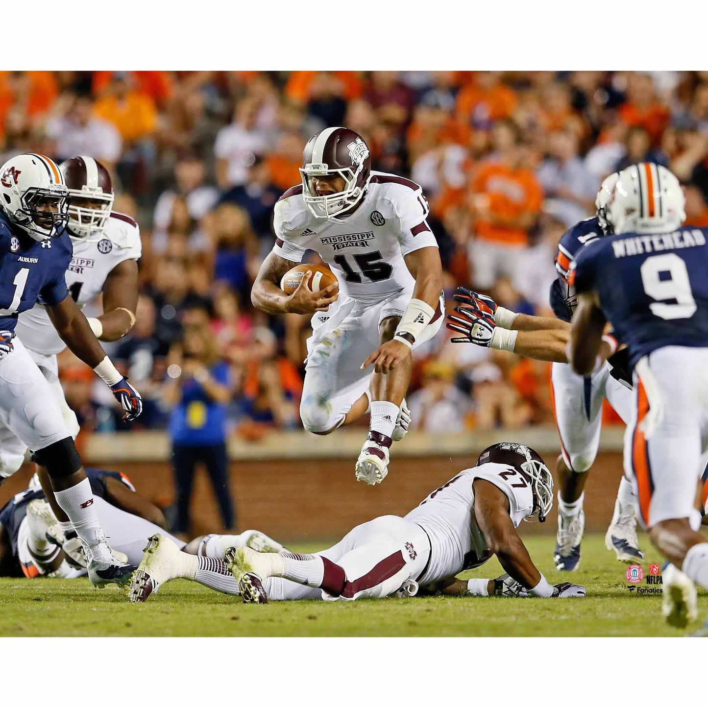 Dak Prescott Mississippi State Bulldogs Unsigned White Jersey Jumping Over Player vs. Auburn Tigers Photograph