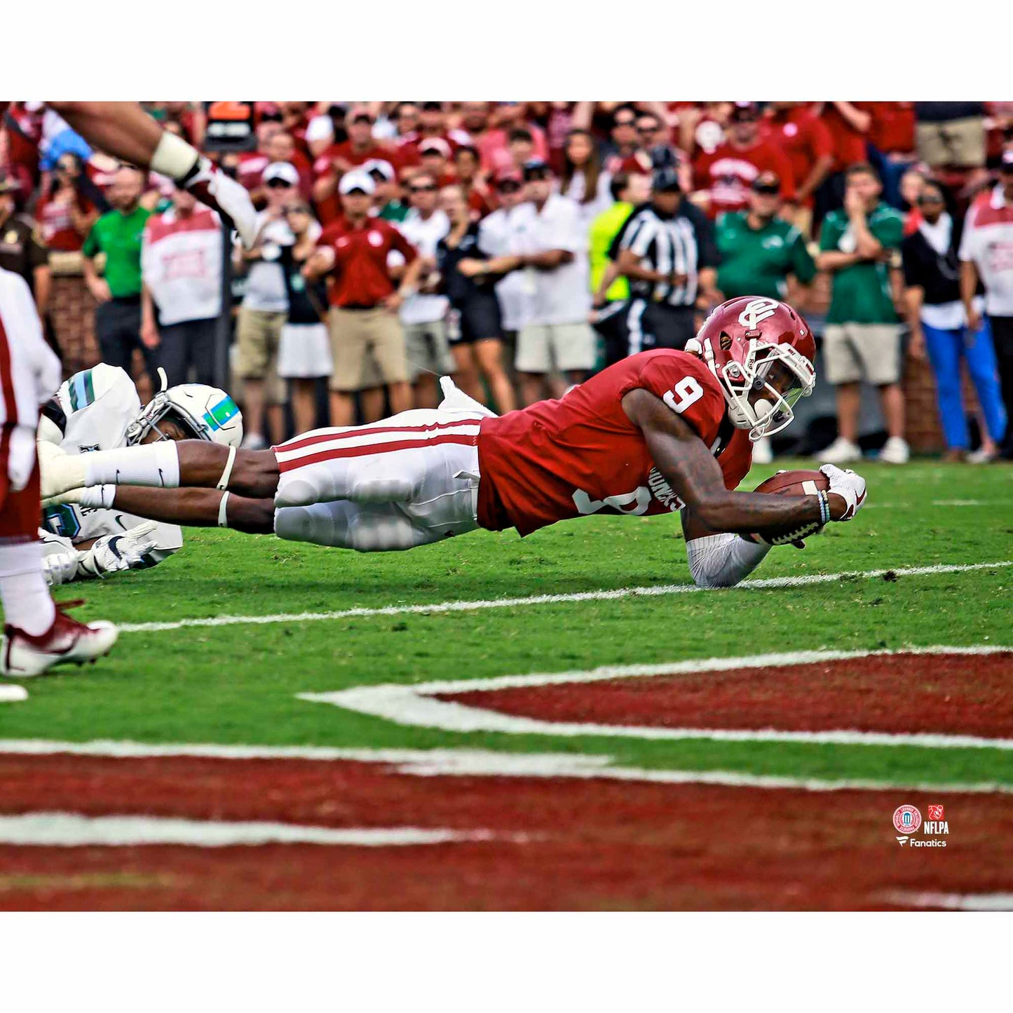 CeeDee Lamb Oklahoma Sooners Unsigned Crimson Jersey Diving For Touchdown Photograph